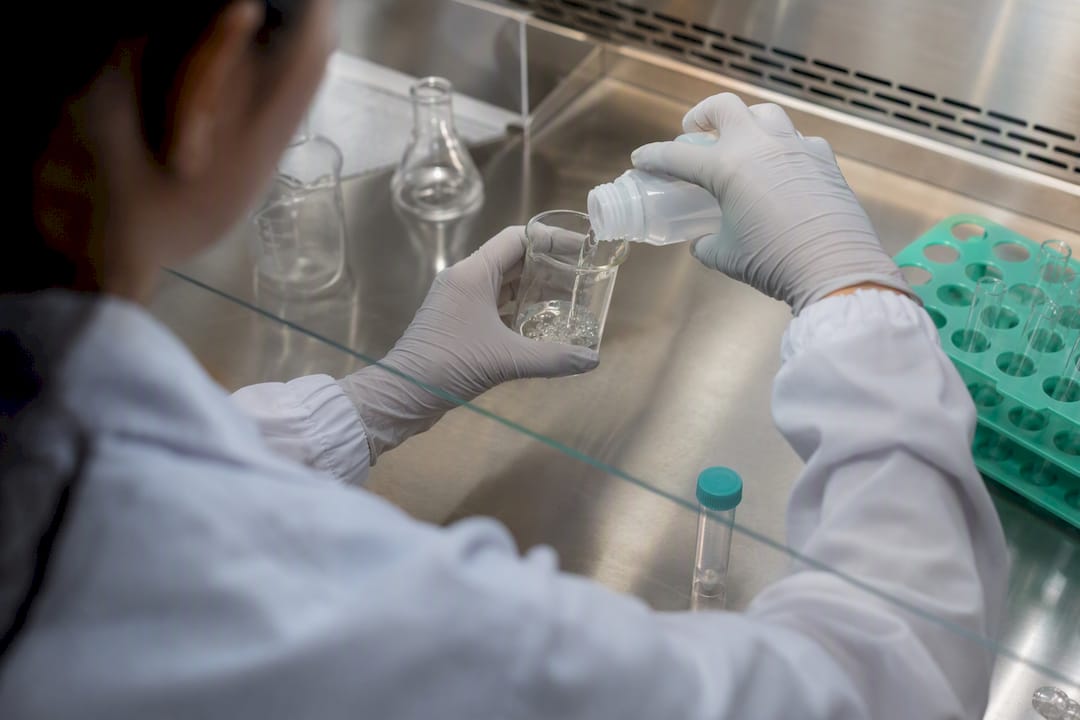 Technician preparing pyrogen-free water sample